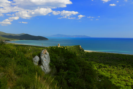 Coastal landscape with an ancient tower on the top of a hill - Maremma Regional Park - Tuscany - Italyの写真素材