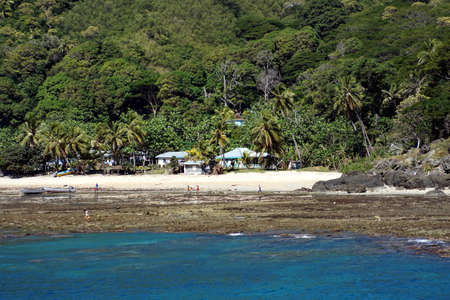 Village on a beach in Fijiの写真素材