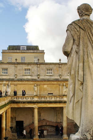 Tourists on the balcony around the sacred pool at the Roman Baths, in Bath, England, UKの写真素材