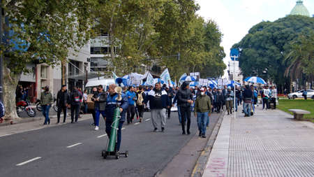 Man with an air horn walking ahead of marchers on the Day of Remembrance in Buenos Aires, Argentinaのeditorial素材