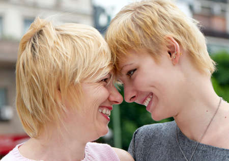A young happy girl with mother