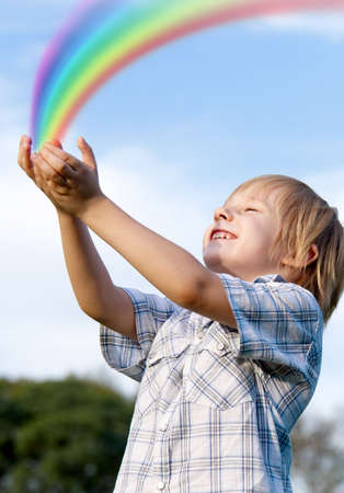 The little boy with stretched hands to skyの写真素材