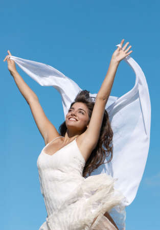 The young beautiful girl against sky. Isolatedの写真素材