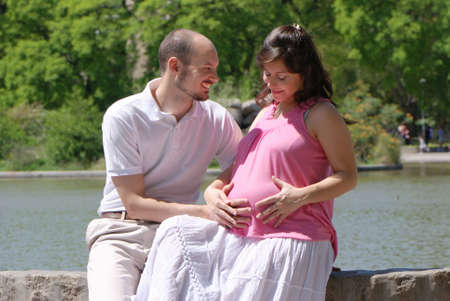 Happy beautiful pregnant woman and her husband