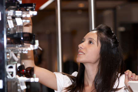 The beautiful young girl in prestigious shopの写真素材