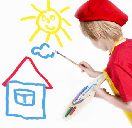 Small artist in a red beret drawing the dreamの写真素材