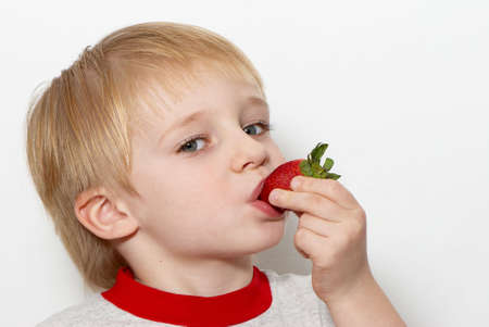 The nice boy with a strawberryの写真素材