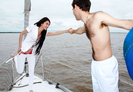 Young couple onboard the yacht during a vacationの写真素材