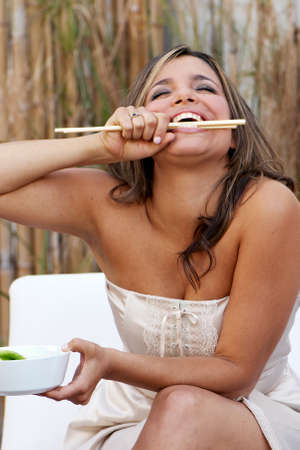 Beautiful latin woman with sticks の写真素材