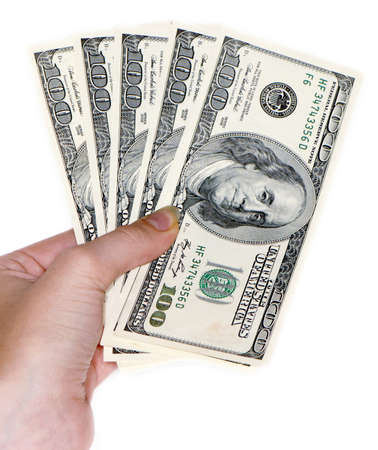 Hand with $100 banknotes stack isolated on white background