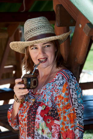 Portrait of the woman drinking a mateの写真素材