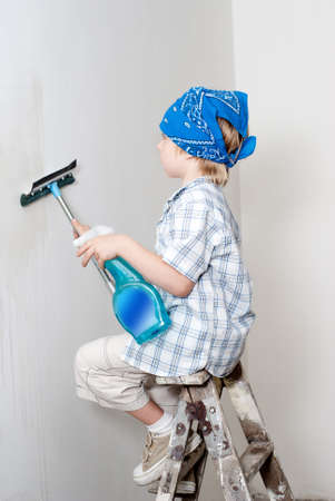 The little boy washing a wallの写真素材