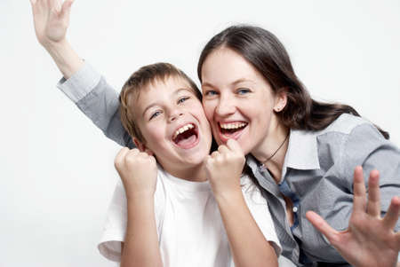 Portrait happy family football fans on light backgroundの写真素材