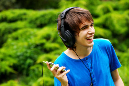 happy teenage boy in headphonesの写真素材