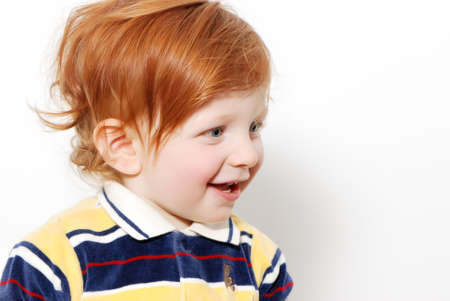 little boy with red hair.Emotionsの写真素材