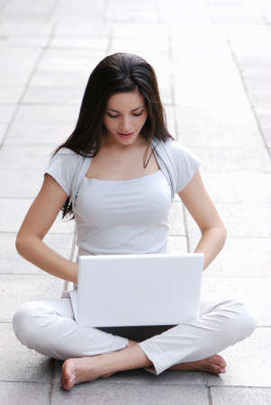 casual success girl on a laptopの写真素材