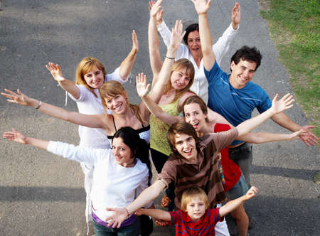 happy people smiling outdoors in a parkの写真素材