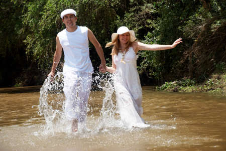 Young, happy couple against the natureの写真素材
