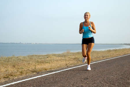 woman running on a summer day の写真素材