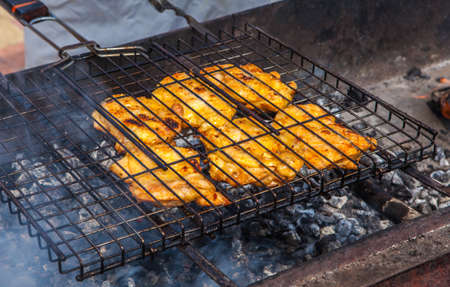 Barbecue. Meat fried in a lattice on coalsの写真素材
