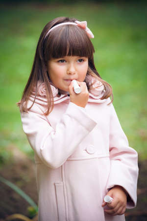 beautiful liitle girl outdoor in parkの写真素材