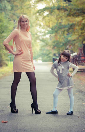 happy young mother with the daughter in parkの写真素材