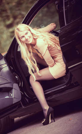 beautiful young happy woman in the new car - outdoorsの写真素材