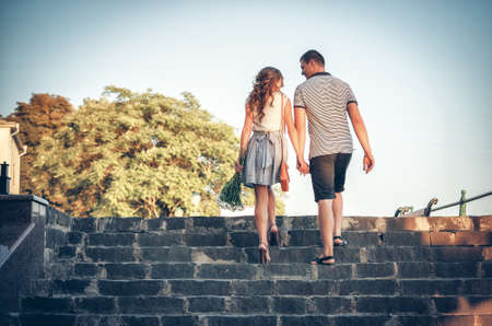 Happy lovers on romantic walk
