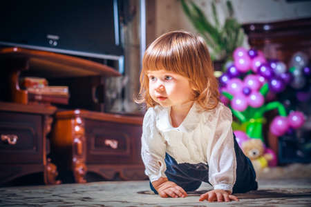 Close up of smiling baby crawling
