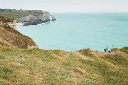Beautiful landscape with long exposure in France by the sea with peaks and rock faces. Clear blue water and a beautiful horizon at noonの写真素材
