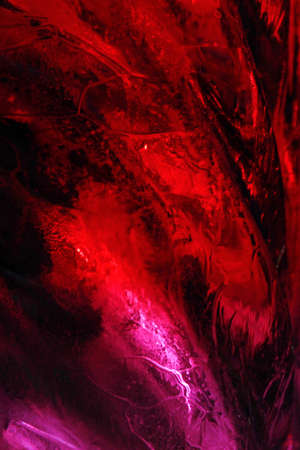 Sculpture fragment of ice in the red lightの写真素材