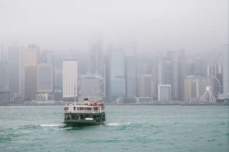 2016/04/12 Hong Kong, skyscrapers in the haze and vapor, view from the waterのeditorial素材