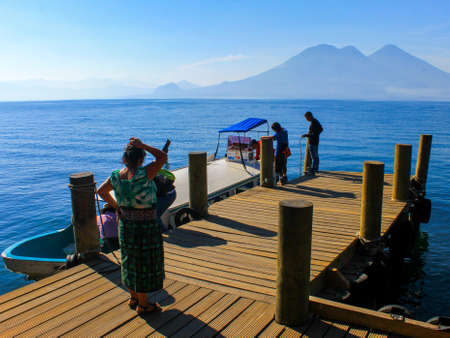 Guatemalan natives preparing their boat in San Marcos de la Laguna bayの写真素材