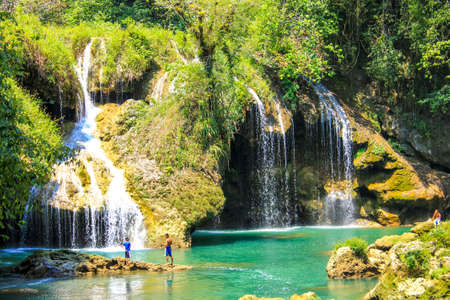 People fishing in Semuc champey natural pool, waterfall and rocks from riversideのeditorial素材