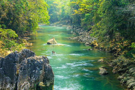 People fishing in Cahabon river next to Semuc champey natural parkのeditorial素材