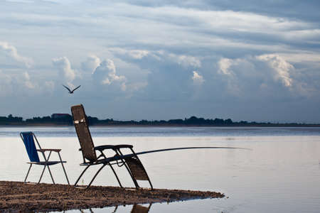 river bank chair fishing tackle fishingの写真素材