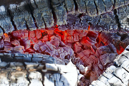 Decaying coals for cooking and a background