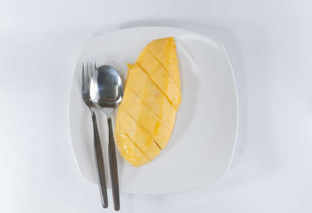 mango slice on white dish