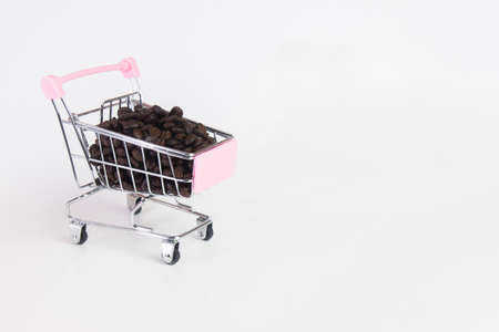 coffee beans in stroller on white backgroundの写真素材