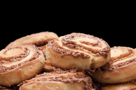 Fresh Cinnamon Rolls Closeup on Black Backgroundの写真素材