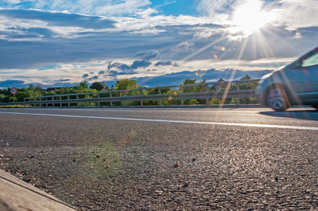Car in motion and direct sunlightの写真素材