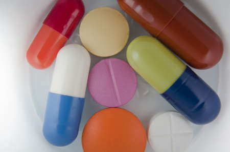 Pills on white cup