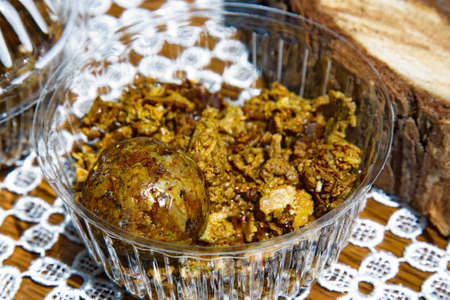 Propolis in the form of a sphere and its pieces. Natural product.