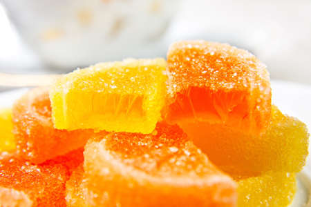 Slices of marmalade and one on the other. Yellow and orange.の写真素材