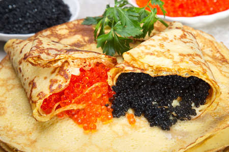 Pancakes with red and black caviar.の写真素材