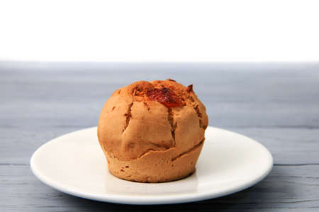 muffin with candied fruits on a saucer