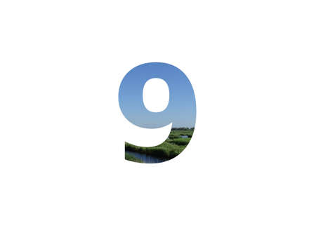 number 9 of the alphabet made with landscape with grass, stream and a blue skyの写真素材