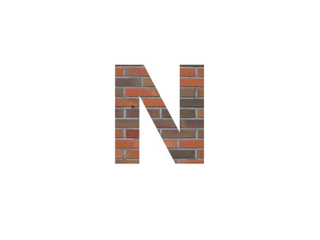 letter N of the alphabet made with wall of bricks, in brown, orange, red gray and isolated on a white backgroundの写真素材