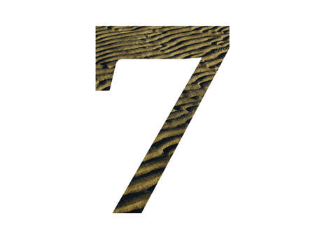 number 7 of the alphabet made with ridges from the beach, color yellow and brown, isolated on white backgroundの写真素材