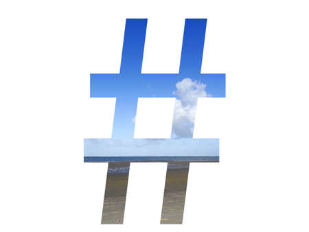 hashtag of the alphabet made with beach, sea and blue sky, north sea, Netherlands, isolated on white...